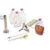 Maple syrup processing kit featuring clear glass bottling flasks with red caps, stainless steel hydrometer test cup, candy thermometers, funnel, and a sugar guide, ideal for orchard and farm use.