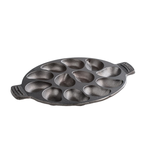 Oval cast iron pan with twelve individual oyster-shaped wells, pre-seasoned and handcrafted, ideal for grilling seafood and versatile cooking in Kitchen & Food, Cast Iron, and Grilling collections.