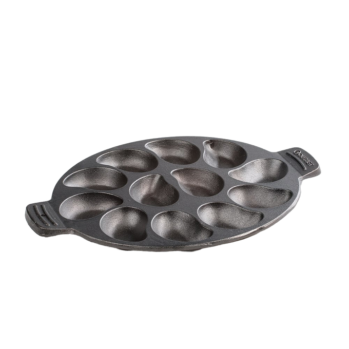 Oval cast iron pan with twelve individual oyster-shaped wells, pre-seasoned and handcrafted, ideal for grilling seafood and versatile cooking in Kitchen & Food, Cast Iron, and Grilling collections.