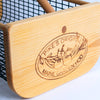 Close-up of a handcrafted wooden end panel with engraved logo on a wire mesh garden hod, made in USA, part of Farm, Garden & Tool, Garden Accessories, and Best Sellers collections.