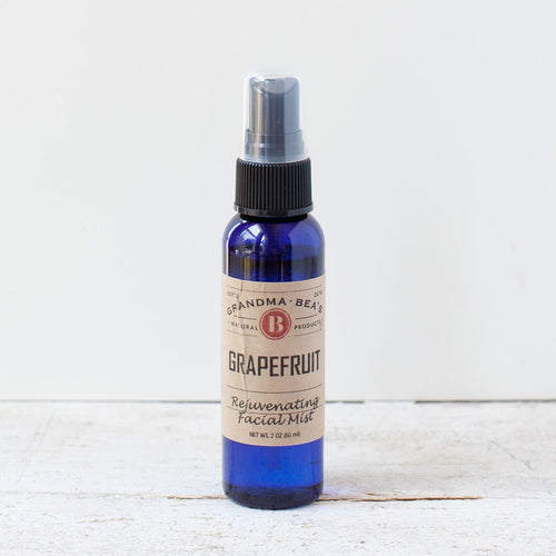 Blue glass spray bottle of all-natural grapefruit facial mist with a pump dispenser, featured in Health & Wellness, Grooming and Personal Hygiene, USA Made, Best Sellers, and Promo Eligible collections.