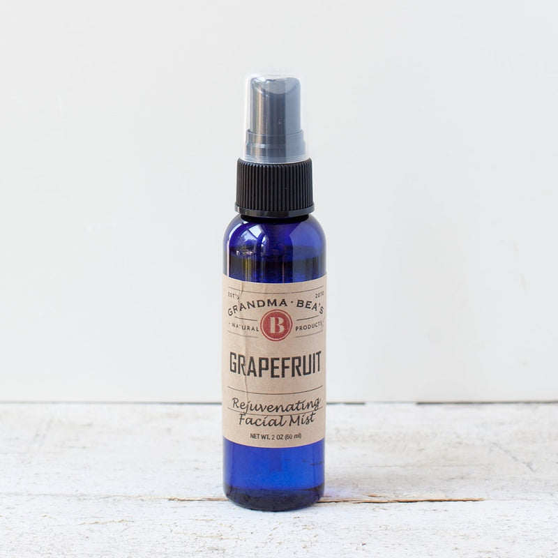 Blue glass spray bottle of all-natural grapefruit facial mist with a pump dispenser, featured in Health & Wellness, Grooming and Personal Hygiene, USA Made, Best Sellers, and Promo Eligible collections.