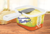 Foldable attachable butter knife with a wide paddle-style blade clipped onto a butter tub, designed for easy spreading and included in Kitchen & Food, Kitchen Gadgets, and Best Sellers collections.