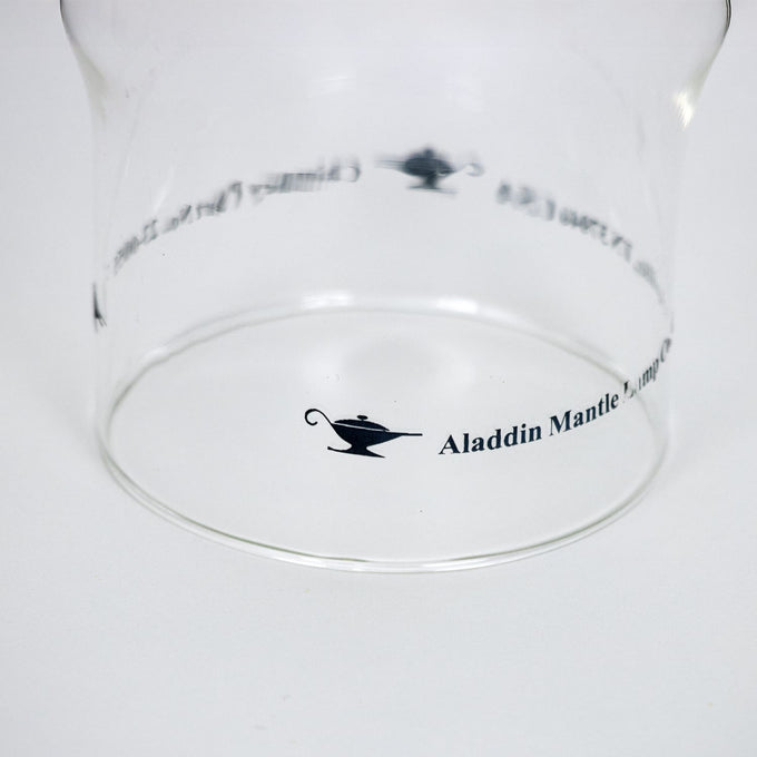 Clear glass chimney with Aladdin Mantle logo printed on the side, designed for use with lamps, lighting parts, chimneys, and best seller collections.