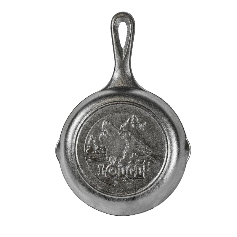 Small cast iron skillet featuring a raised wolf and mountain design, handcrafted in the USA, ideal for Kitchen & Food, Cast Iron, Cookware, and Best Sellers collections.
