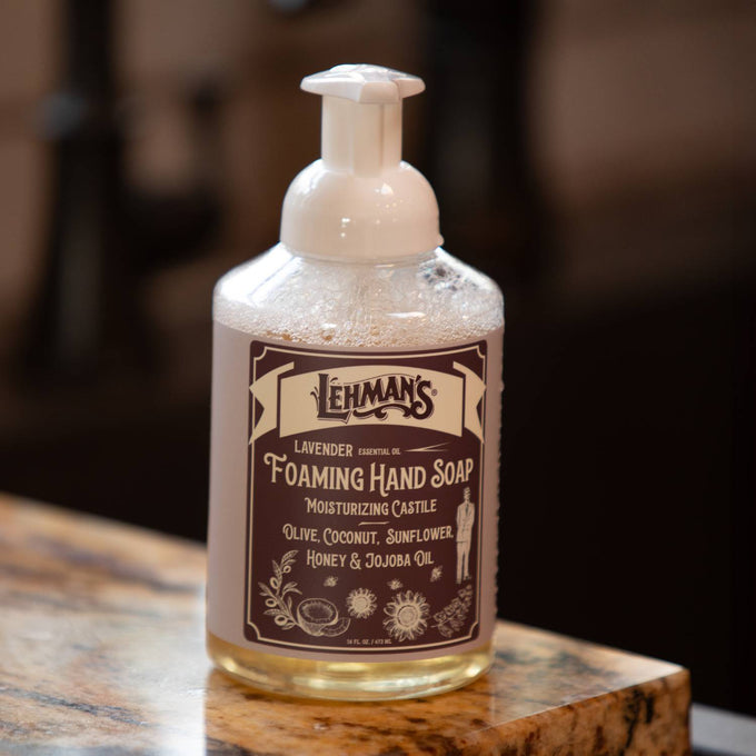 Clear pump bottle of handcrafted moisturizing foaming hand soap with lavender essential oil, made in USA with natural castile formula including olive, coconut, sunflower, honey, and jojoba oils, ideal for Health & Wellness, Grooming and Personal Hygiene, Soaps and Soapmaking, and Best Sellers collections.