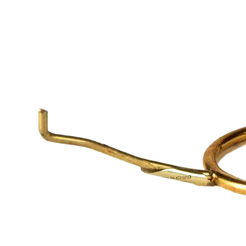 Close-up view of a solid brass tripod holder arm designed to support lamp shades, suitable for lamps & lighting, parts and accessories, shade rings and holders, best sellers, and promo eligible collections.