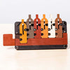 Handcrafted wooden brainteaser puzzle featuring six interlocking bottles in earth tones on a tray, designed to challenge problem solvers; part of Toys, Books & Games and Best Sellers collections.