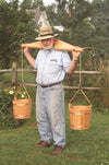 Handcrafted Amish made shoulder yoke crafted from smooth poplar wood with attached rope handles holding wooden buckets, designed for comfortable heavy load carrying, featured in Farm, Garden & Tool and USA Made collections.