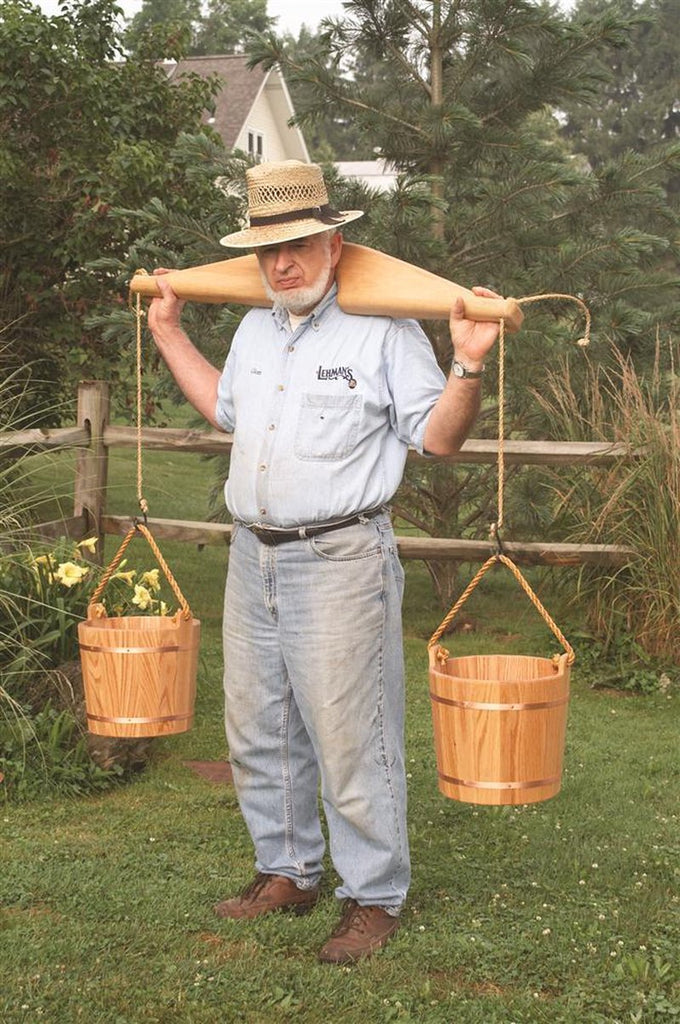 Handcrafted Amish made shoulder yoke crafted from smooth poplar wood with attached rope handles holding wooden buckets, designed for comfortable heavy load carrying, featured in Farm, Garden & Tool and USA Made collections.