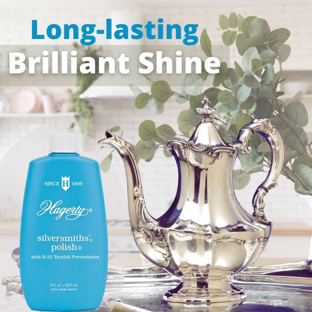 Blue bottle of silver polish next to a highly polished ornate silver teapot, highlighting long-lasting shine for Home & Decor and Household Cleaning collections.