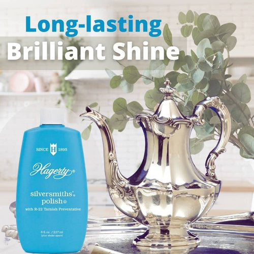 Blue bottle of silver polish next to a highly polished ornate silver teapot, highlighting long-lasting shine for Home & Decor and Household Cleaning collections.