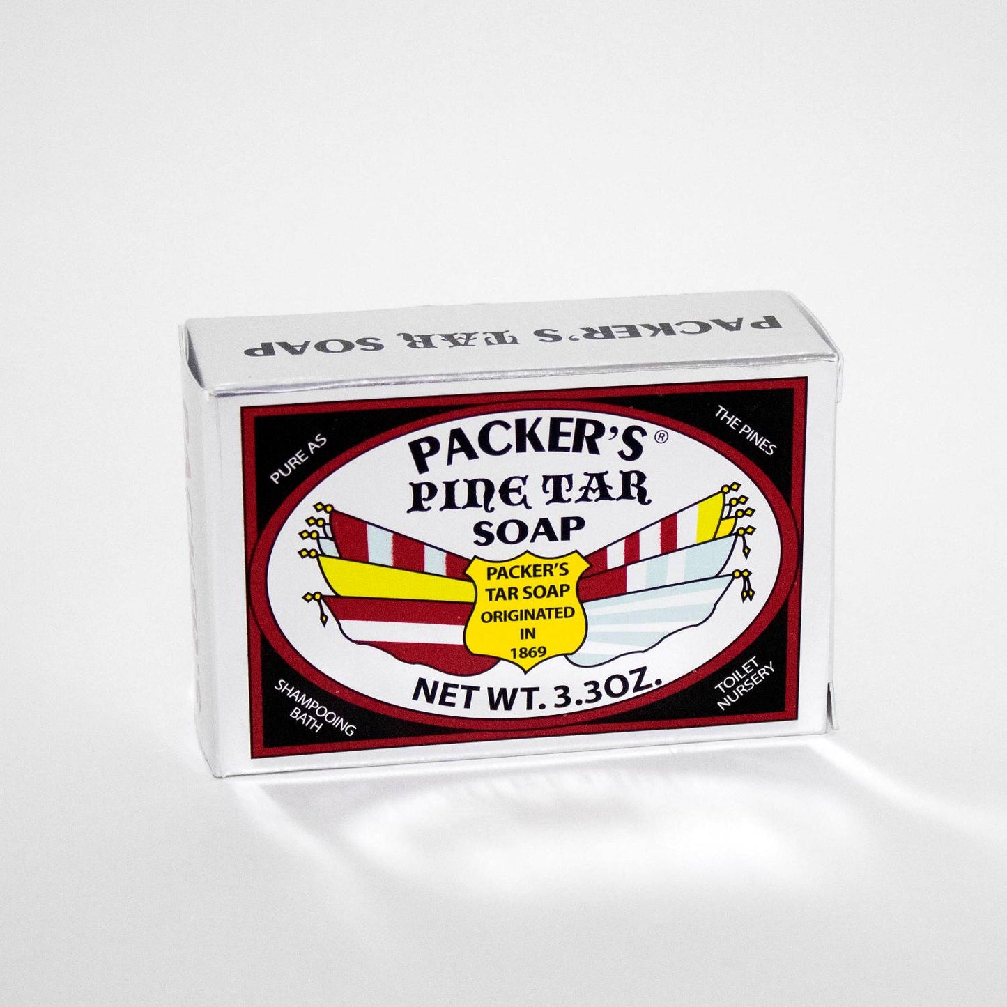 Single bar of Packer's Pine Tar soap in rectangular packaging with bold black and red label, made in USA, featured in Health & Wellness and Grooming collections.