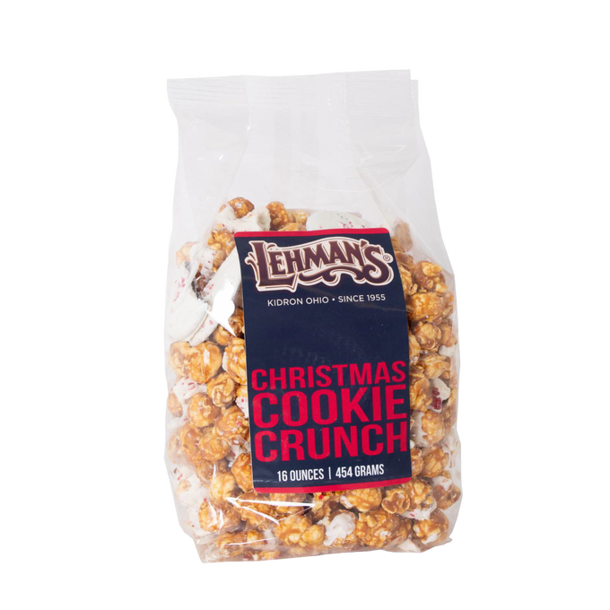Clear plastic bag of handcrafted caramel popcorn mixed with festive holiday cookie pieces, labeled Christmas Cookie Crunch, featured in Kitchen & Food, Snacks and Sweets, Popcorn, Best Sellers, and Promo Eligible collections.