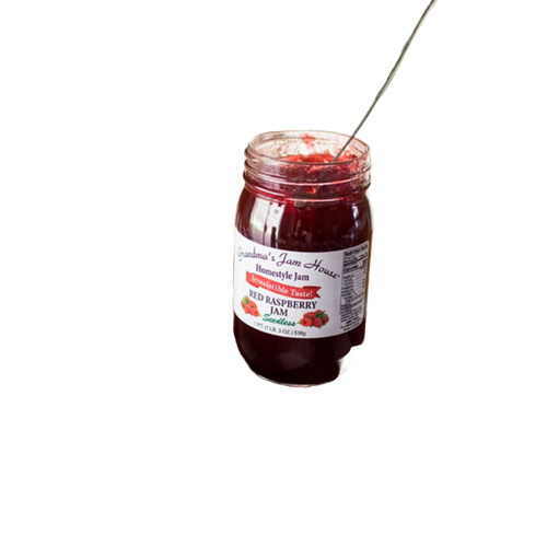 Handcrafted glass jar of seedless red raspberry jam with white label featuring raspberry illustrations, spoon inside, ideal for Kitchen & Food, Pantry, Peanut Butter & Jellies, USA Made, Best Sellers, Promo Eligible collections.