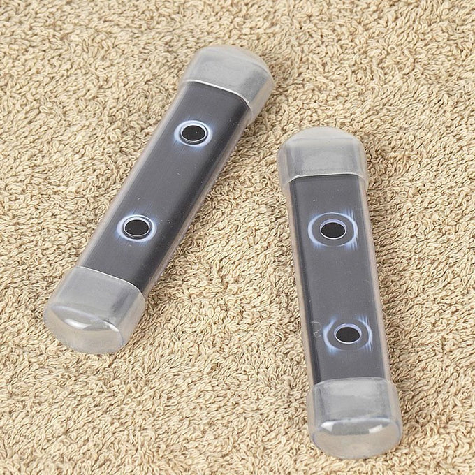Two clear plastic housings each containing long-lasting magnets designed to prevent mineral stains in toilet tanks, featured in Home & Decor and Household Cleaning collections.