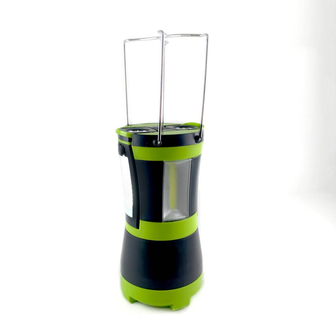 Portable black and green LED lantern with foldable metal handles, designed for versatile illumination in camping, emergency supplies, and outdoor lighting collections.