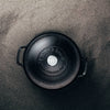 Overhead view of a handcrafted black cast iron Dutch oven lid with embossed logo and sturdy handles, featured in Kitchen & Food, Cookware, Cast Iron, USA Made, and Best Sellers collections.