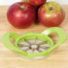Green-handled apple wedge cutter with stainless steel blades placed on a wooden surface beside three red apples, perfect for food prep and apple harvest collections.