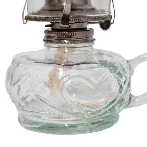 Close-up of a handcrafted clear glass oil lamp font with a unique finger hold on the side, part of Lamps & Lighting, Oil Lamps, Table Lamps, and Best Sellers collections.
