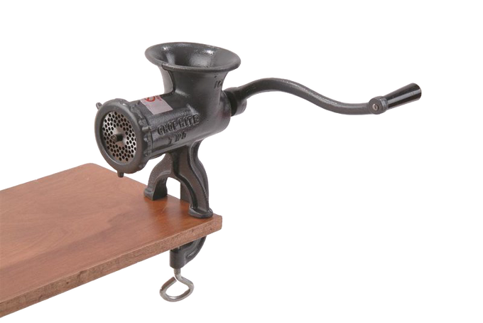 Heavy-duty clamp-down metal meat grinder with long crank handle attached to wooden surface, featuring durable construction and suitable for Kitchen & Food, Specialty Equipment, Butchering Supplies, USA Made, Best Sellers, and Promo Eligible collections.