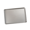Durable aluminized steel half sheet pan with ribbed surface for even heat distribution, ideal for baking cakes, jelly rolls, and roasting vegetables, part of Kitchen & Food and USA Made collections.