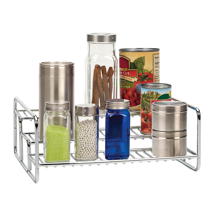 Chrome-finished 3-tiered wire rack holding assorted spice jars, cans, and containers, designed for organizing pantry, kitchen gadgets, and storage while maximizing space efficiency.