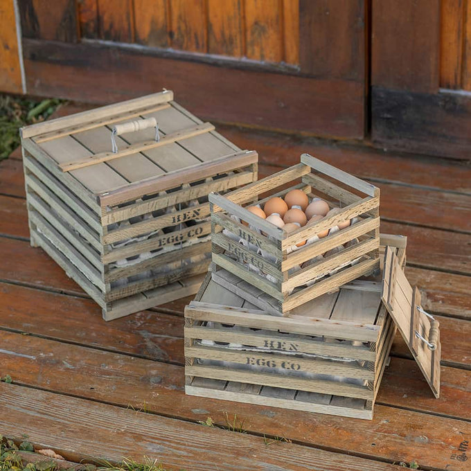 Three handcrafted wooden egg crates with slatted sides and hinged lids, holding fresh eggs; perfect for farm, garden, animal care, and chicken accessories in best sellers and promo collections.