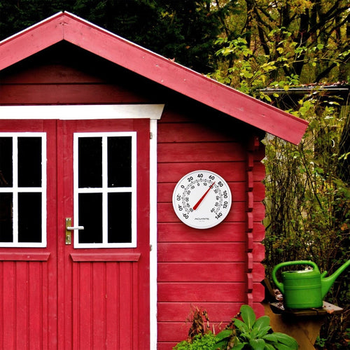 White 12-inch outdoor thermometer with large black numbers and red needle mounted on red wooden garden shed, easy-to-read temperature display in Fahrenheit, featured in Farm, Garden & Tool and Garden Accessories collections.
