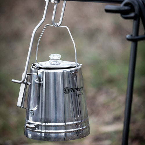 Stainless steel pouring aid securely holding a percolator suspended outdoors, ideal for safe coffee serving in Farm, Garden & Tool, Camping, Best Sellers, and Promo Eligible collections.