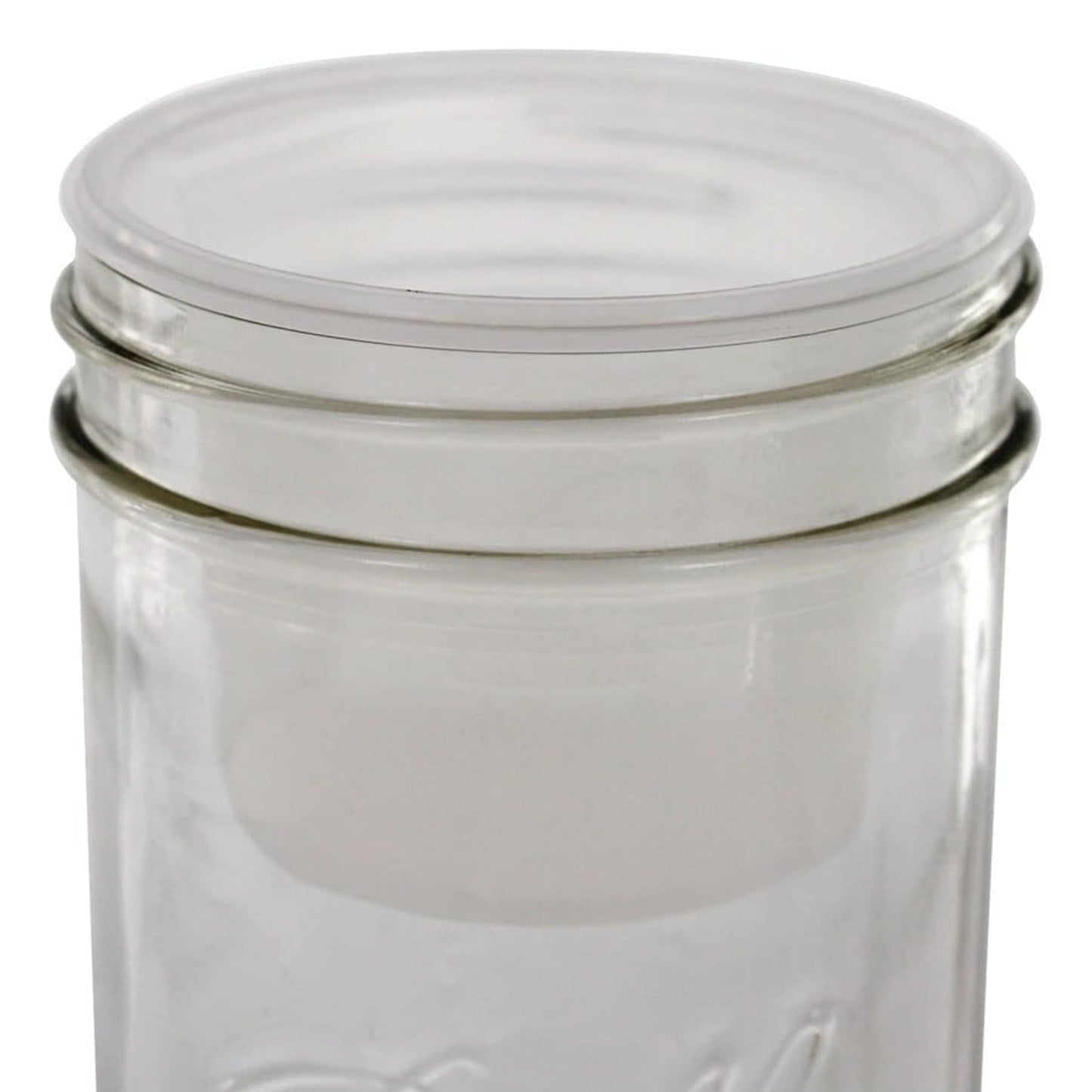 Clear plastic divider cup designed to fit inside wide-mouth jars, creating two compartments for organized food storage, ideal for Kitchen & Food and USA Made collections.