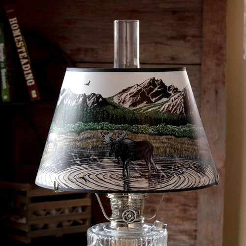 Handcrafted parchment oil lamp shade featuring a detailed Rocky Mountain scene with a moose standing in a rippled pond, surrounded by forest and rugged peaks, ideal for Lamps & Lighting, Parts and Accessories, Lamp Shades, and Best Sellers collections.