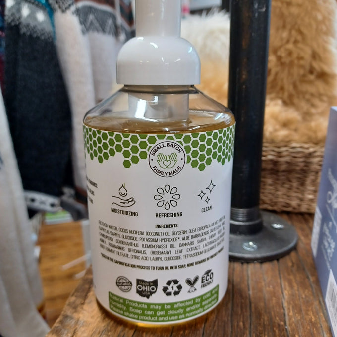 Back label of a 16 fl oz pump bottle of Beessential Natural Foaming Hand Soap, highlighting moisturizing qualities with honey and natural extracts, handmade in small batches in Ohio, USA, suitable for Health & Wellness, Soaps, USA Made, and Best Sellers collections.
