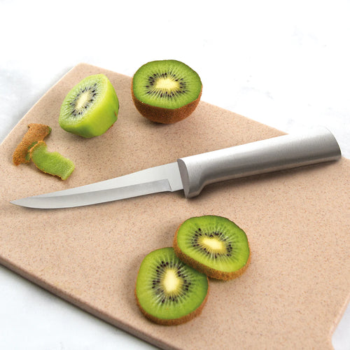 Handcrafted Rada Super Parer with high carbon surgical steel blade and solid aluminum handle slicing fresh kiwi on a cutting board, ideal for kitchen knives and food prep collections.