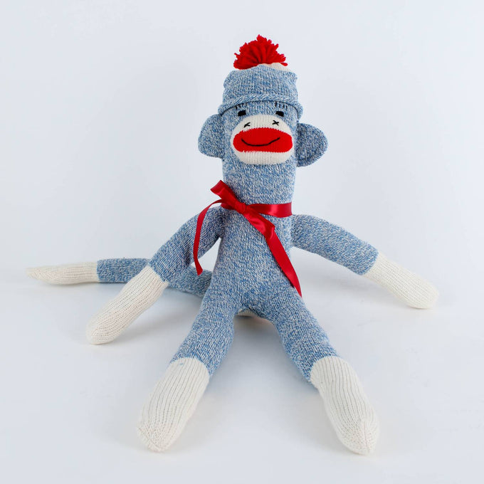 Handcrafted blue and white sock monkey with red pom-pom hat and matching ribbon, made in USA, featured in Toys, Books & Games, USA Made, Children's Toys, Indoor Play, and Best Sellers collections.