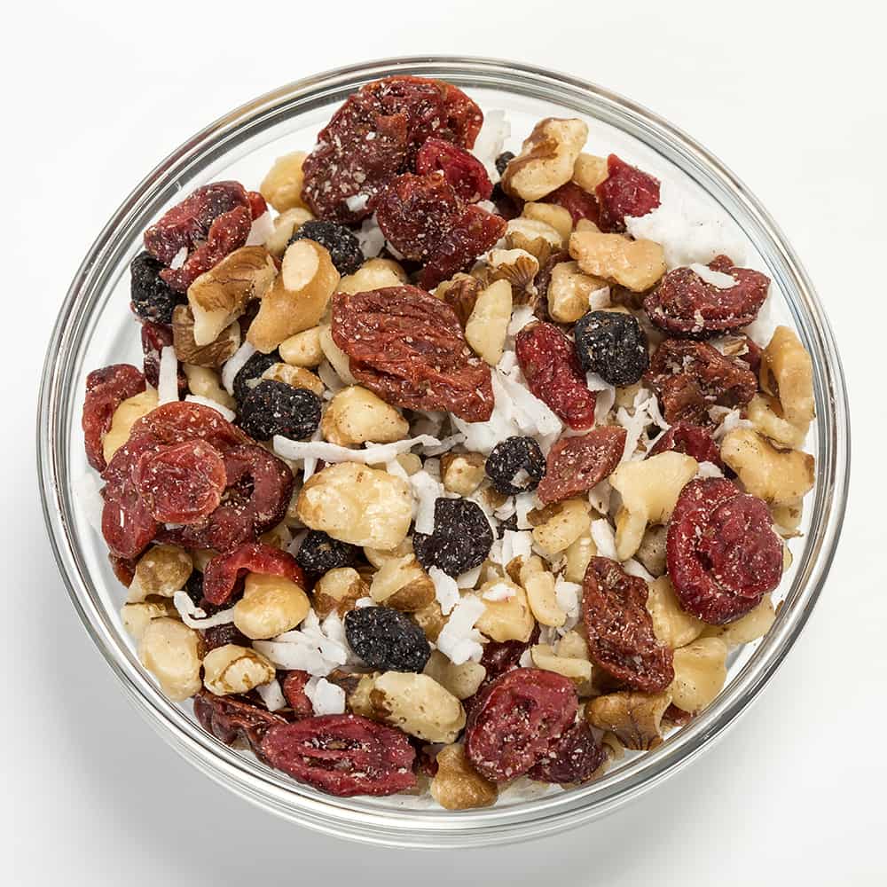Clear glass bowl filled with a protein-rich snack mix of roasted black walnuts, dried cherries, cranberries, blueberries, and shredded coconut, perfect for Kitchen & Food, Snacks and Sweets, Pantry, USA Made, and Best Sellers collections.