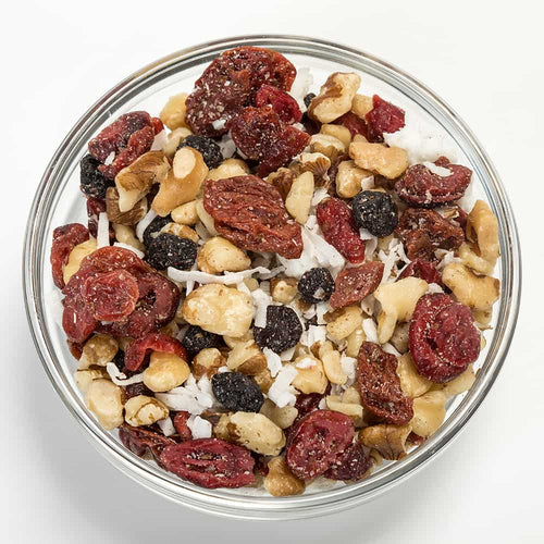 Clear glass bowl filled with a protein-rich snack mix of roasted black walnuts, dried cherries, cranberries, blueberries, and shredded coconut, perfect for Kitchen & Food, Snacks and Sweets, Pantry, USA Made, and Best Sellers collections.
