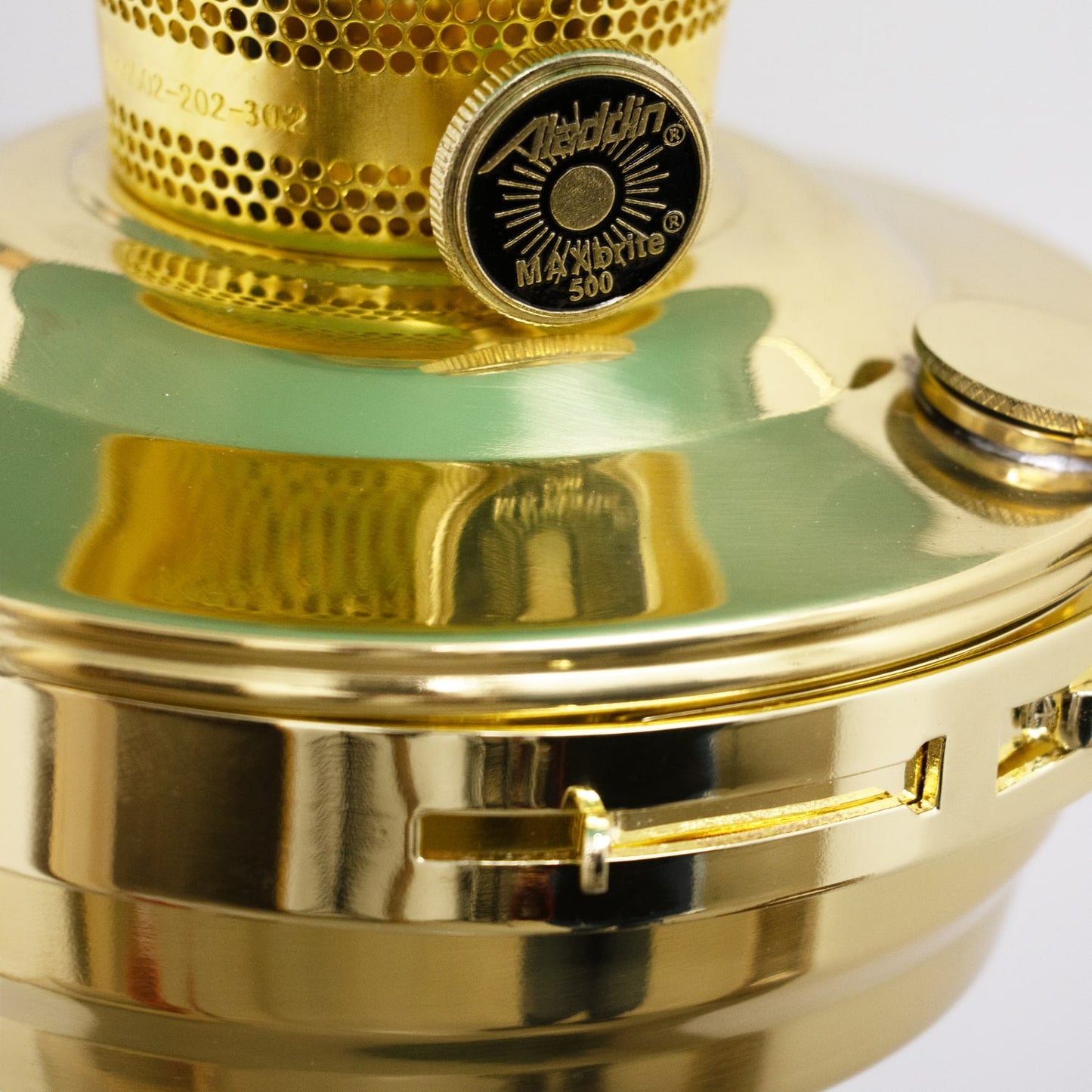 Close-up of a gleaming solid brass oil lamp burner featuring a detailed control knob and ventilation holes, handcrafted and showcased in Farm, Garden & Tool and Lamps & Lighting collections.