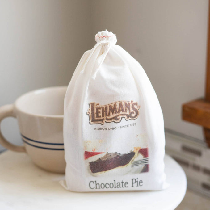 Soft white drawstring bag with Lehman’s logo and image of chocolate pie slice, handcrafted Amish style, suited for Kitchen & Food, Snacks and Sweets, and Best Sellers collections.