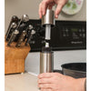 Handcrafted stainless steel non-aerosol mister with 8 oz capacity, shown being assembled on kitchen counter near knife block and skillet, ideal for Kitchen & Food, Cookware, Baking Supplies, Kitchen Gadgets, Cooking and Baking Helpers, Best Sellers, and Promo Eligible collections.