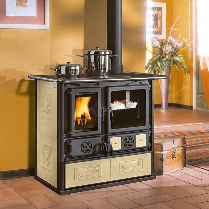 Cream and black cast iron wood cook stove with ceramic glass fire door showing burning fire, porcelain enameled oven with temperature gauge, ideal for Stoves, Cookstoves, Best Sellers, and All Stoves & Appliances collections.