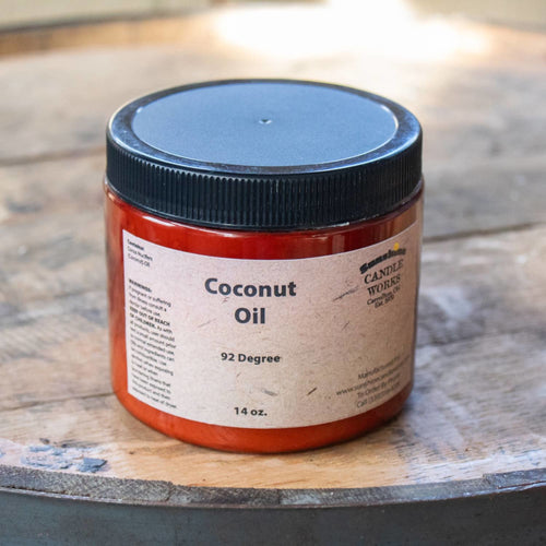 Amber container of handcrafted pure coconut oil for soap making at 92 degrees and 14 oz, featuring a simple beige label and black lid, perfect for Health & Wellness and Soapmaking Supplies collections.