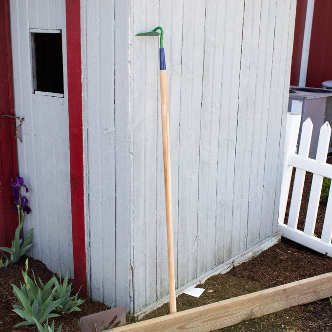 Handcrafted Amish-made garden hoe with a green steel blade and natural wood handle, designed for weeding and soil cultivation, part of Farm, Garden & Tool and Digging and Cultivating collections.