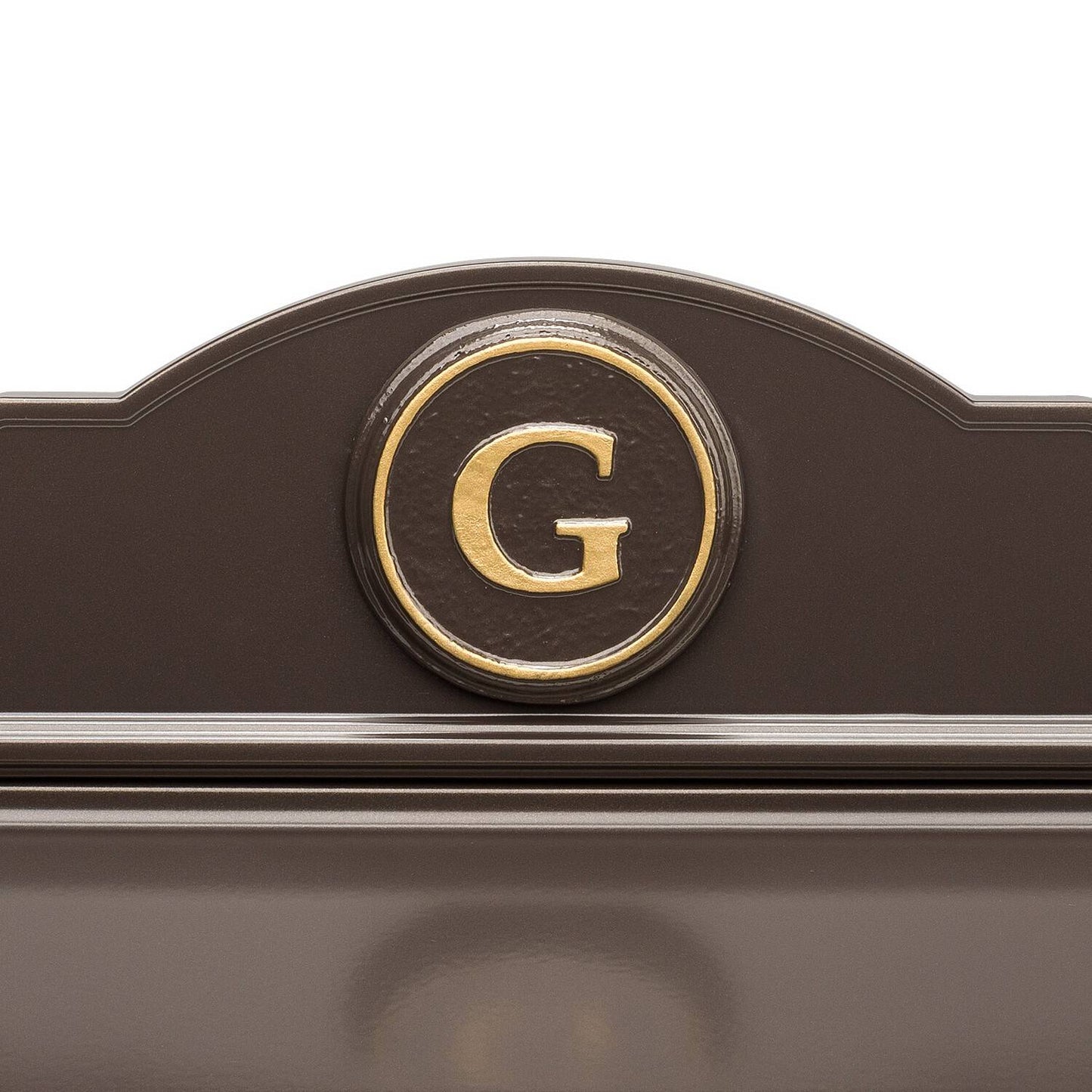 Close-up of a handcrafted bronze and gold wall mount mailbox featuring a personalized gold letter monogram on a round medallion, made in USA for Home & Decor and Mailboxes collections.