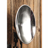 Concave mercury reflector with locking nut mounted on rustic wooden surface, designed for vintage oil lamps, handcrafted with slight imperfections, featured in Lamps & Lighting collections.