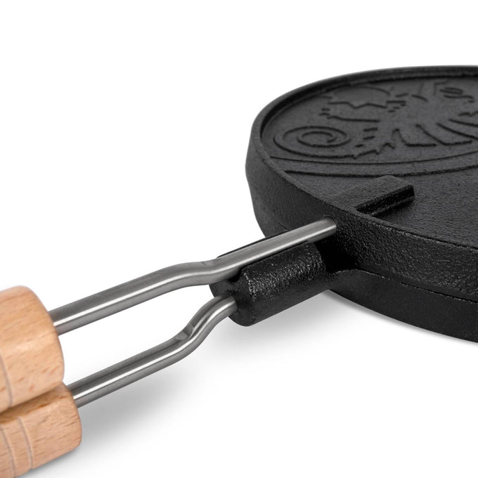 Close-up of a handcrafted cast iron rotating waffle iron with wooden handles, designed for outdoor camping and farm tool use, featured in Best Sellers and Promo Eligible collections.
