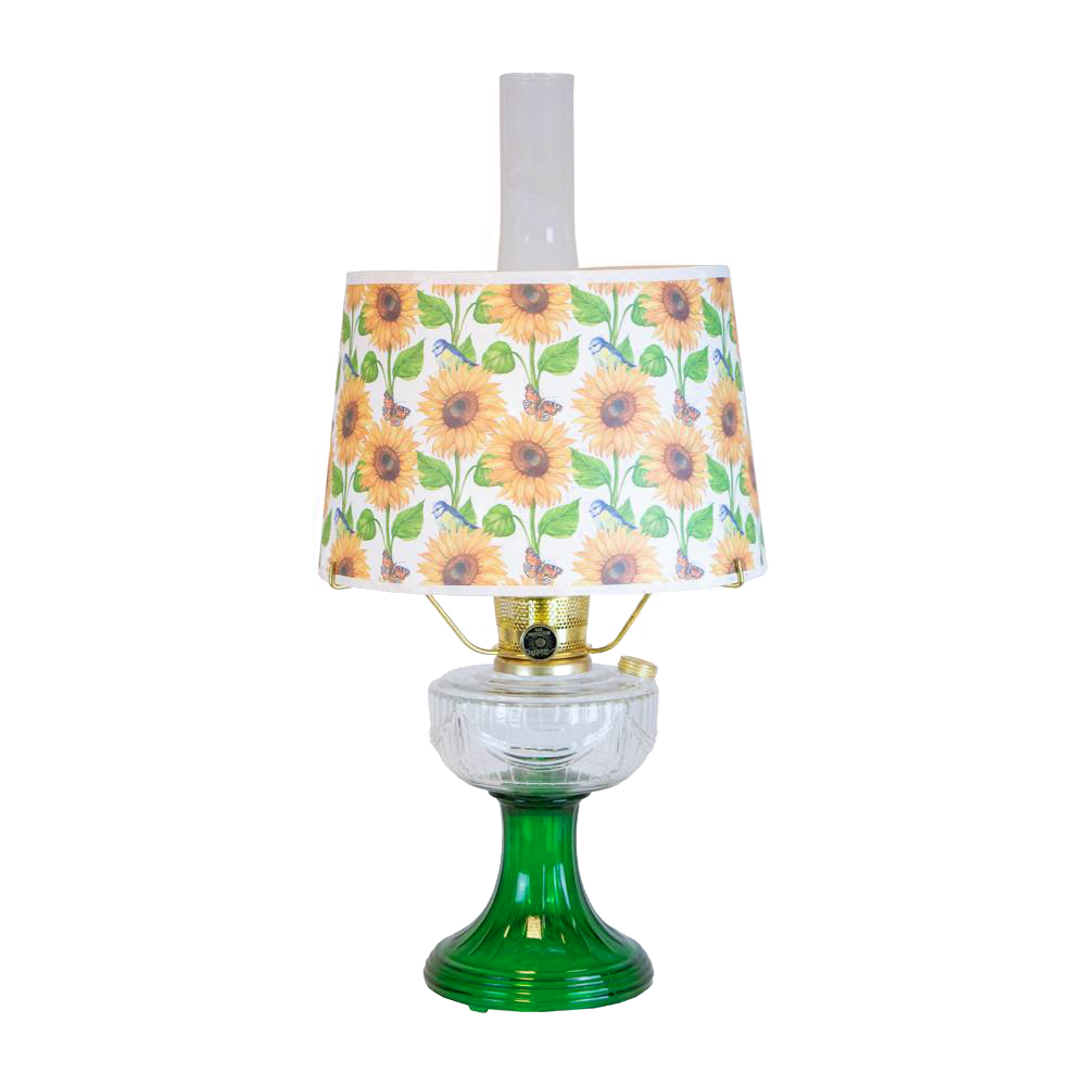 Unique handcrafted oil lamp with a clear and emerald green glass base paired with a sunflower-patterned shatterproof parchment shade, perfect for Farm, Garden & Tool, Lamps & Lighting, and Emergency Supplies collections.