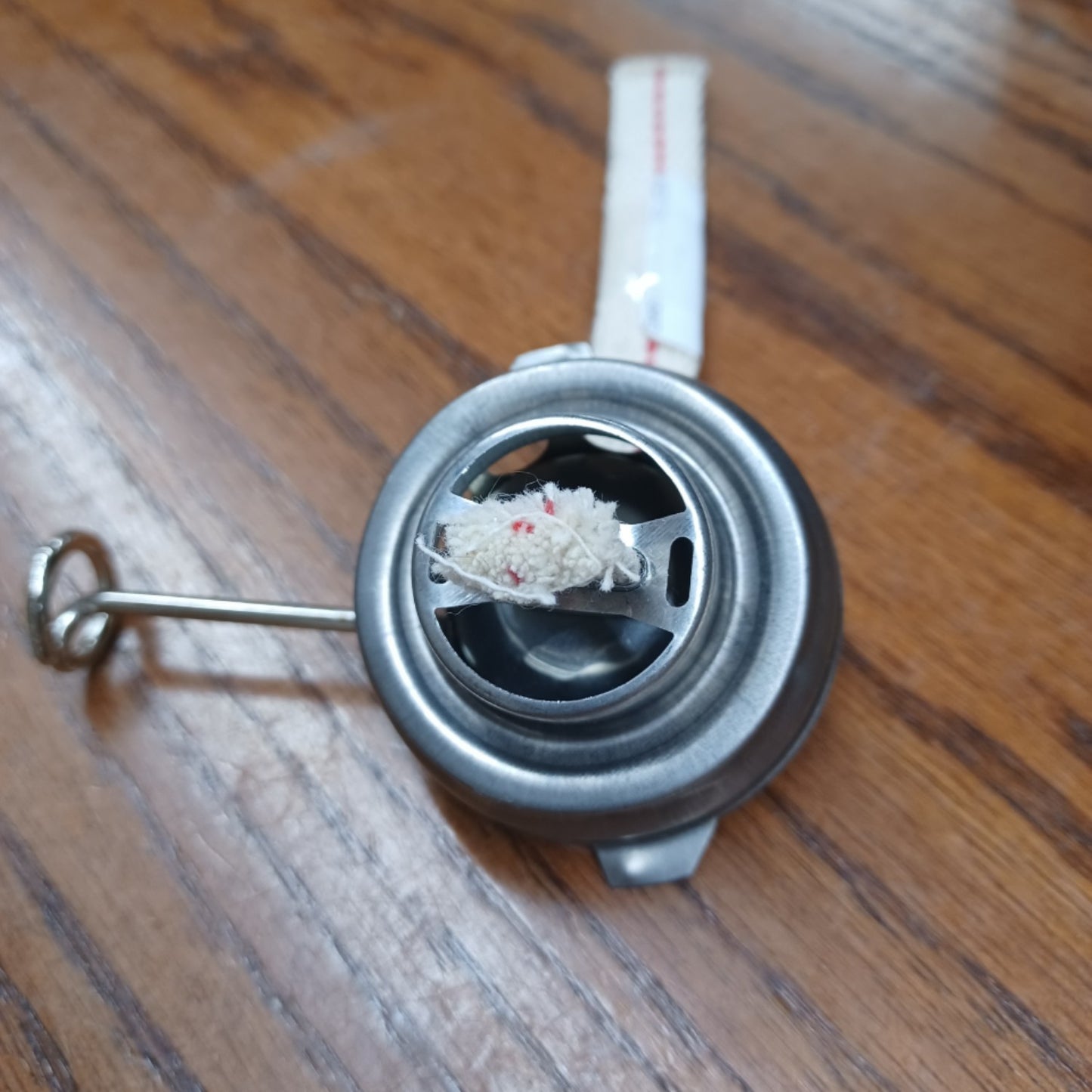 Close-up of a metal burner component with a wick for an Air Pilot oil lantern, ideal for lamps and lighting, camping, emergency supplies, and outdoor use collections.