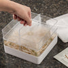 Hand removing a removable divider from a stackable seed sprouter with clear trays and a white base, ideal for growing fresh sprouts, featured in Farm, Garden & Tool and USA Made collections.