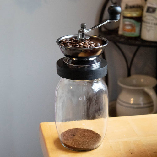 Handcrafted Mason jar coffee grinder with a ceramic burr and hand crank, designed for smooth, consistent grinding, featured in Kitchen & Food, Brewing Coffee and Tea, Kitchen Gadgets, and Best Sellers collections.
